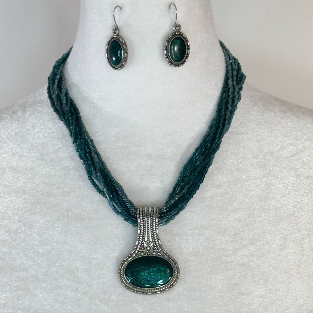 Blue beaded necklace with blue stone charm and matching earrings